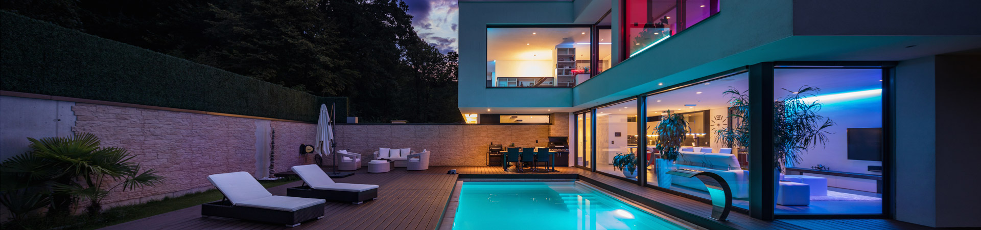 Modern villa with coloured led lights at night